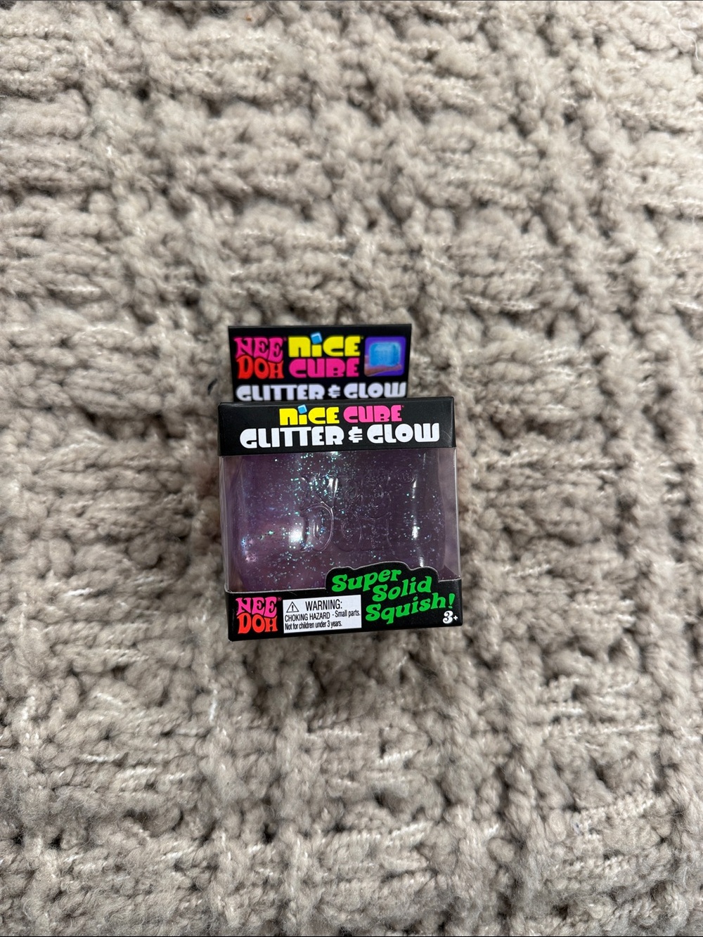 Schylling NeeDoh Nice Cube Glitter & Glow Super Solid Squish - Purple Glitter